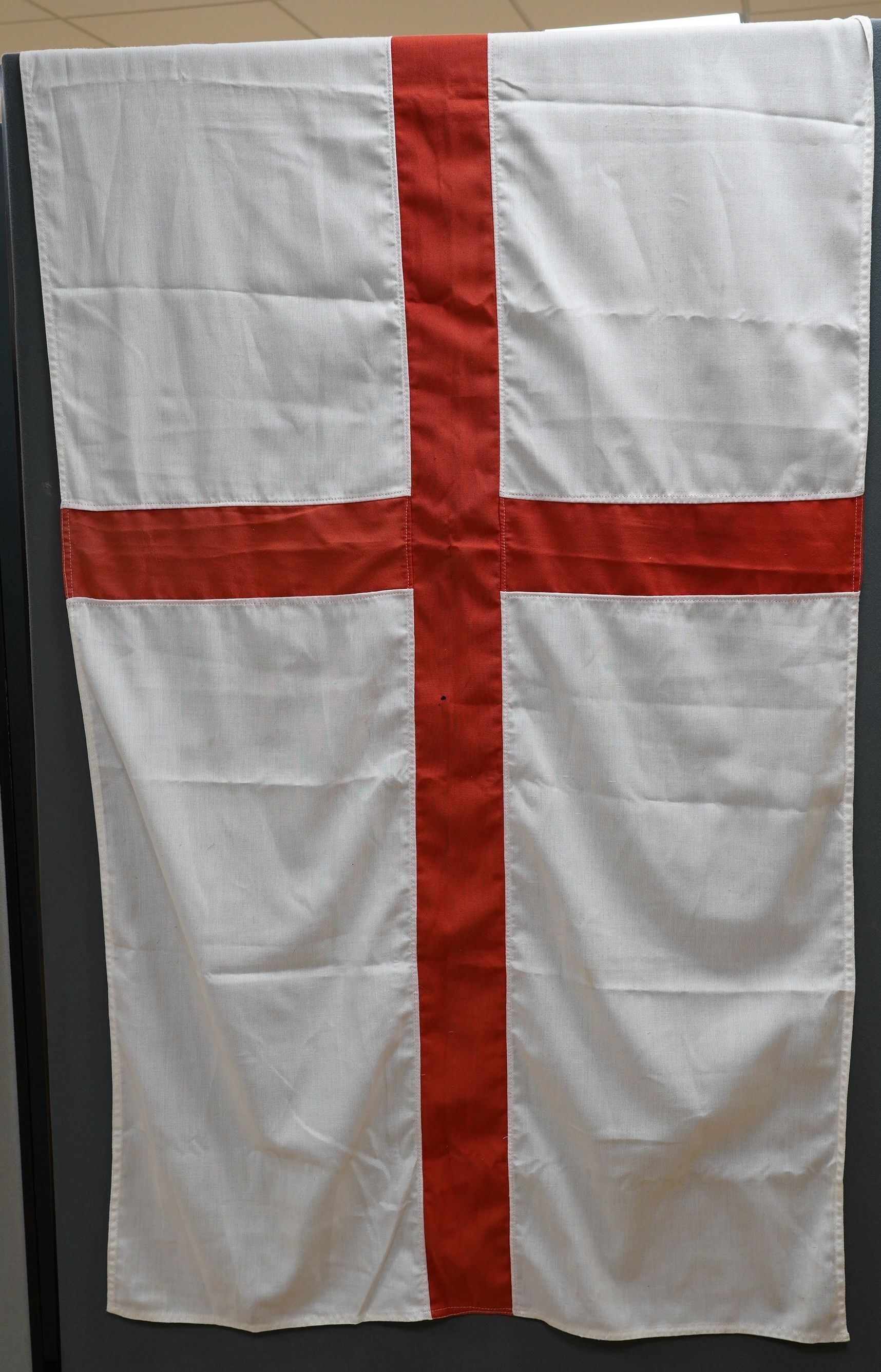 Eight mostly mid 20th century Union Jack flags, one celebrating Queen Victoria’s Diamond Jubilee, together with a Saint George’s cross and a string of Union flag bunting. Condition - poor to good